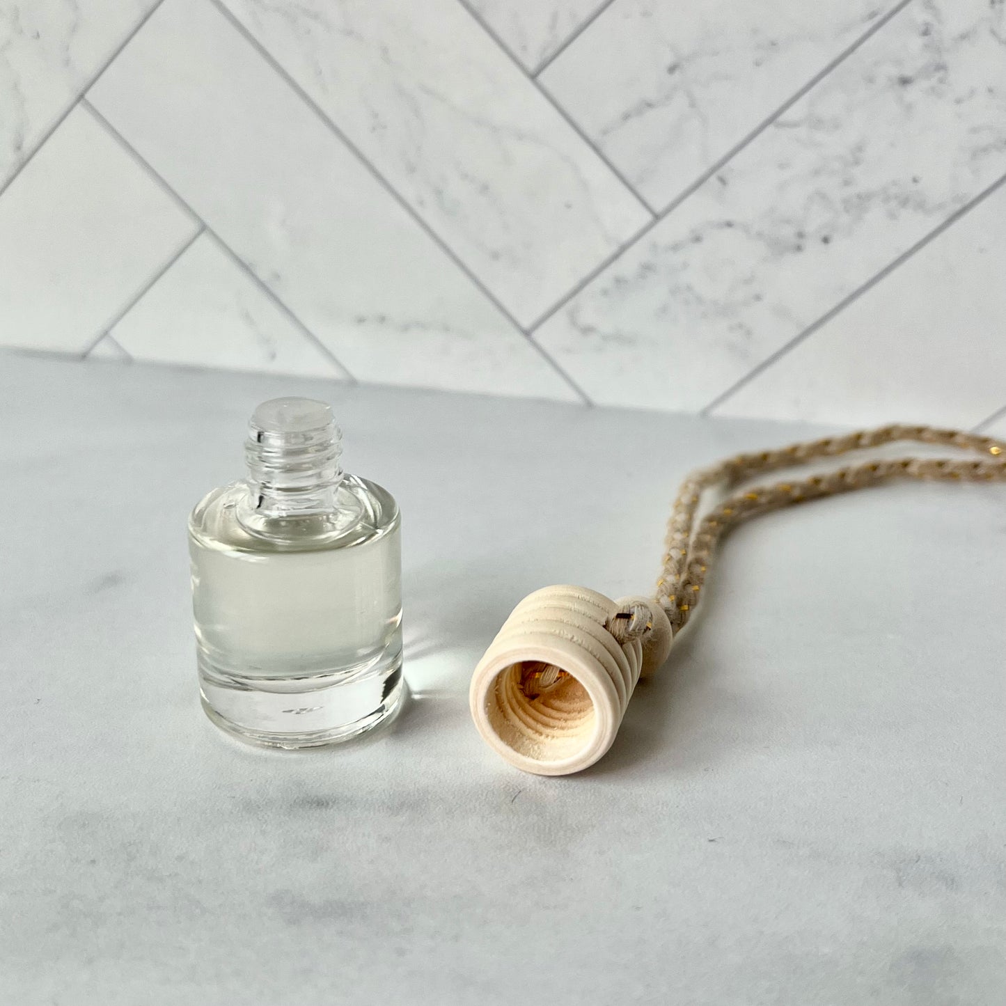 The car diffuser shown with its wooden top removed