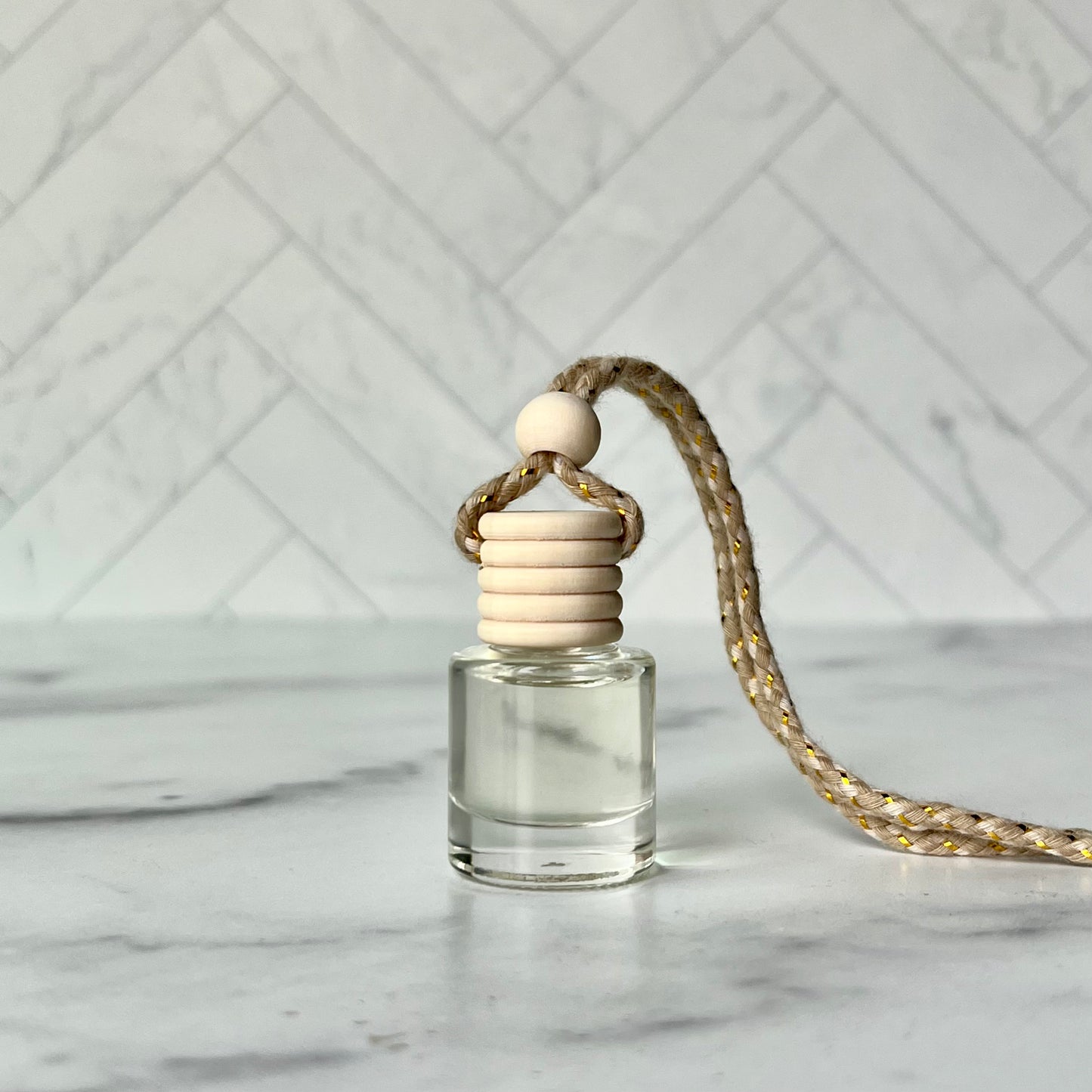 The car diffuser on a gray marble surface