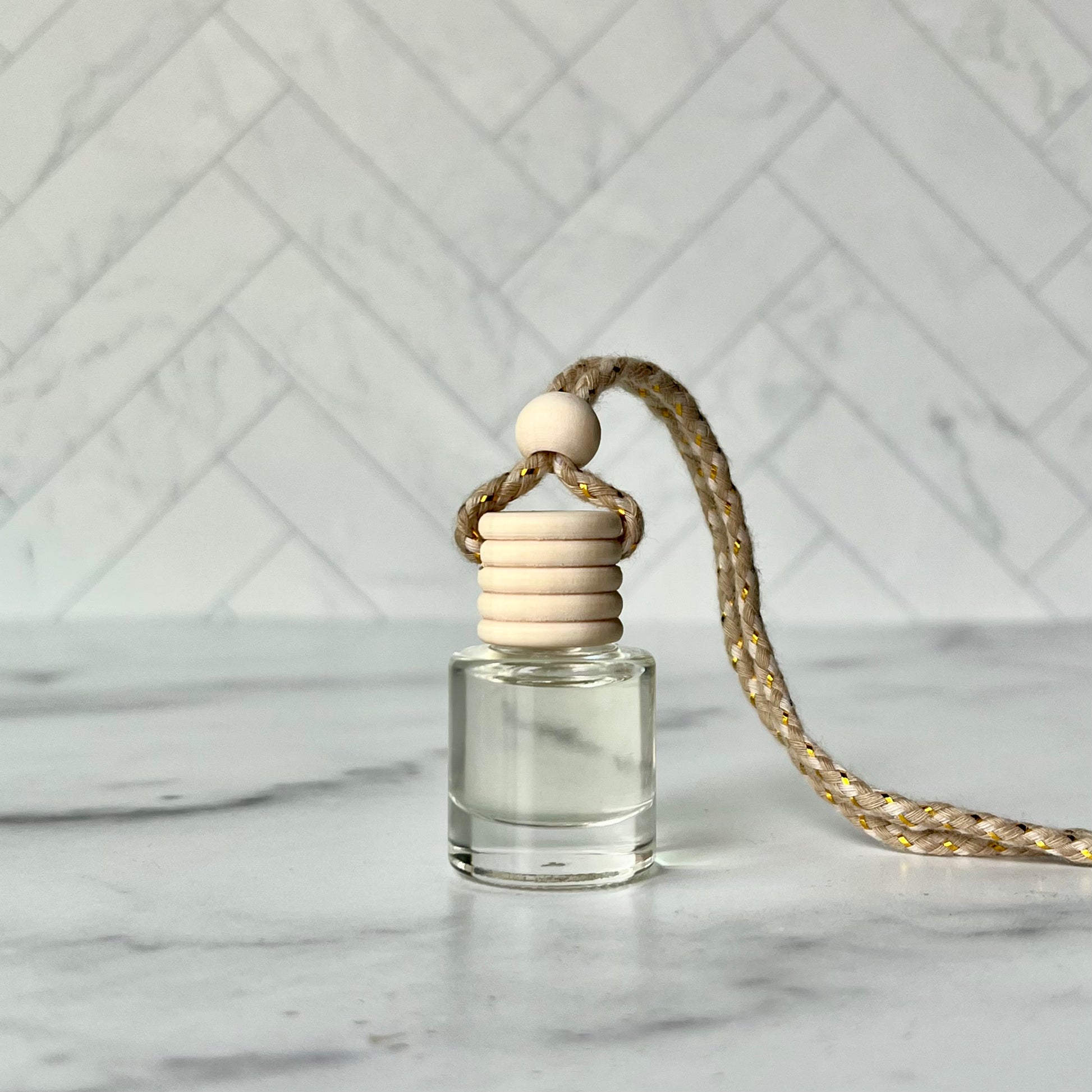 The car diffuser on a gray marble surface