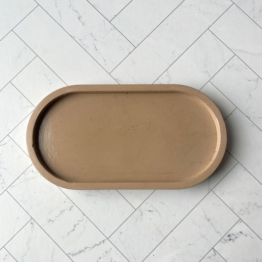 A light brown oval tray shown from overhead