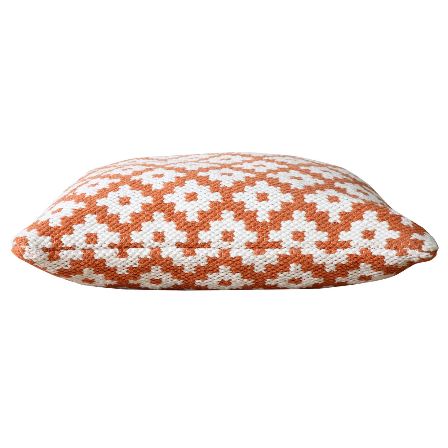 The throw pillow on its side to show its thickness