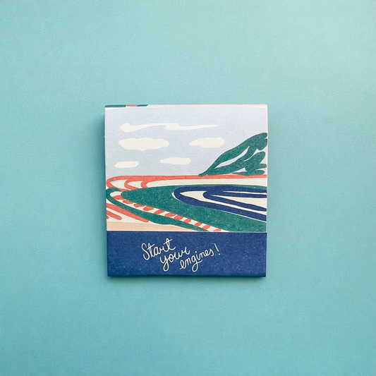 Front of race car matchbook showing a drawing of a race track