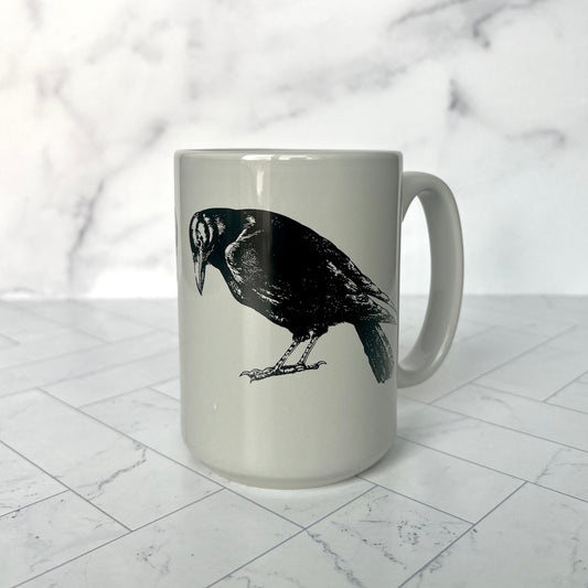 The light gray Crow Mug against a light gray background
