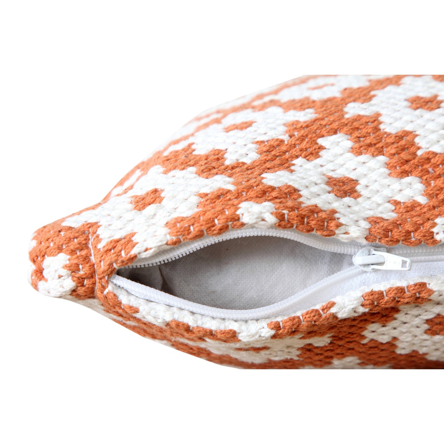 The geo-floral pillow shown on its side with its zipper open to show how the insert can be removed
