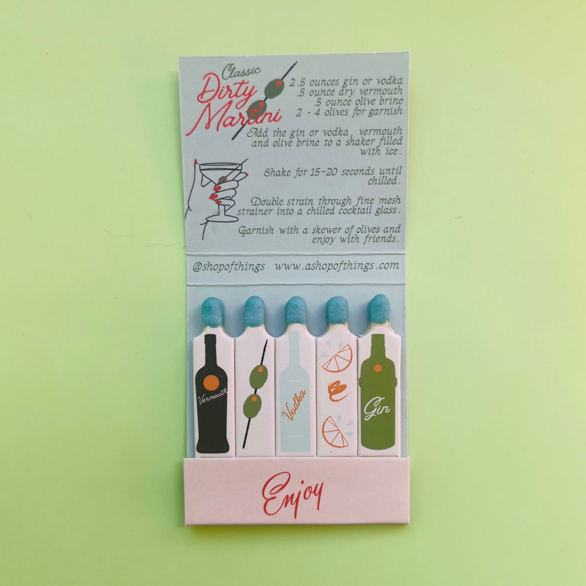 Inside of the martini matchbook showing the recipe and illustrations of martini ingredients on each individual matchstick