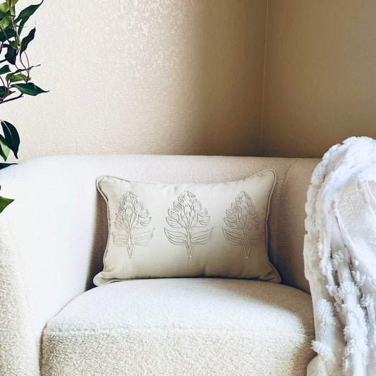 Eloise Embroidered Pillow Cover shown on a white accent chair - The Offbeat Co.