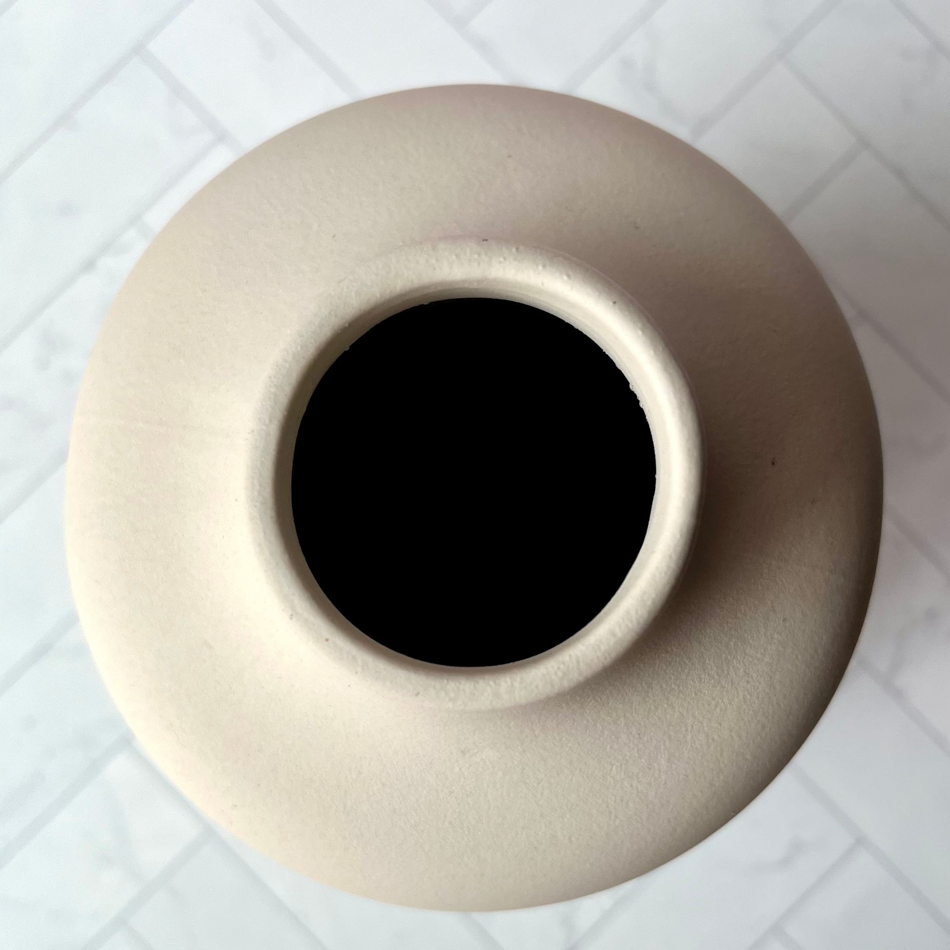 The Curvy White Vase shown from overhead, showing the size of its top opening