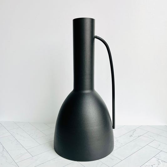 The Sleek Black Vase on a white surface