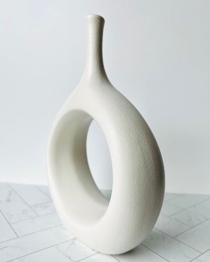 The Hollow Round Vase shown from the side