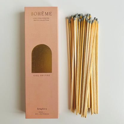 The Long Seraphina Scented Matches shown from above on a table with the box sitting next to the matches - The Offbeat Co.