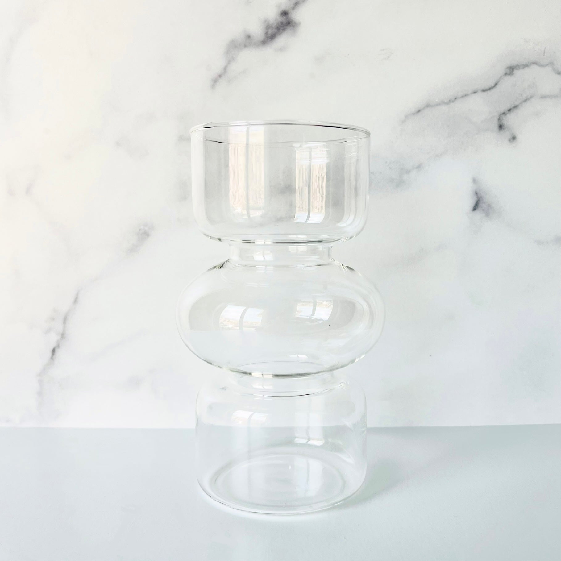 The Curvy Glass Vase shown against a light background