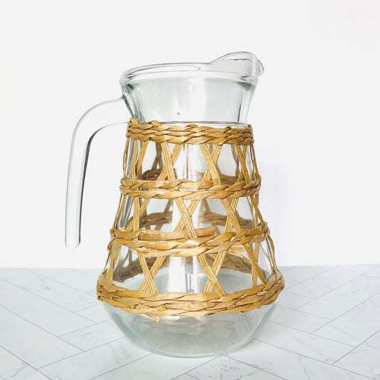 Rattan-wrapped Pitcher on a light surface - The Offbeat Co.