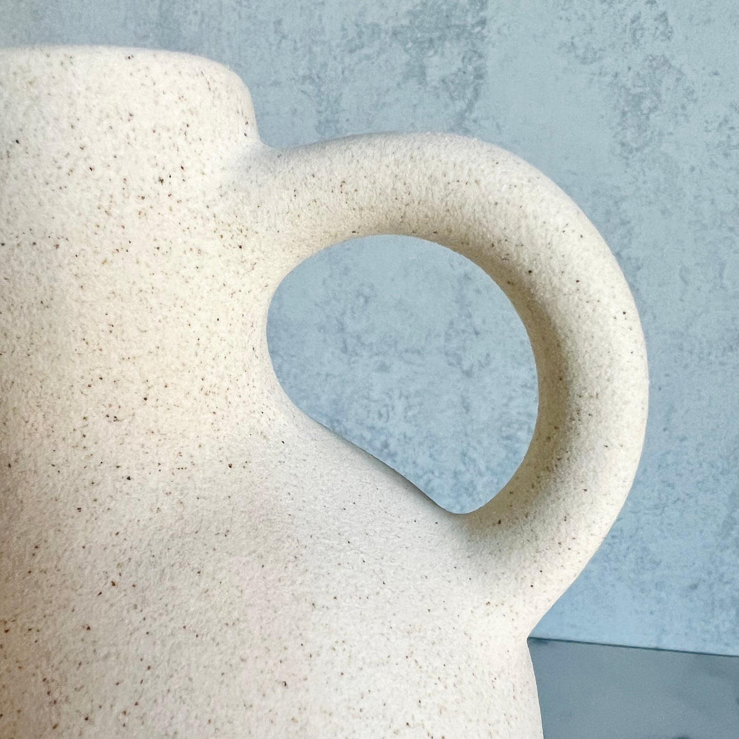 A close up of the handle on the Tulum White Vase