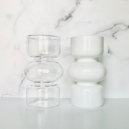 The Curvy Glass Vase shown in clear and white