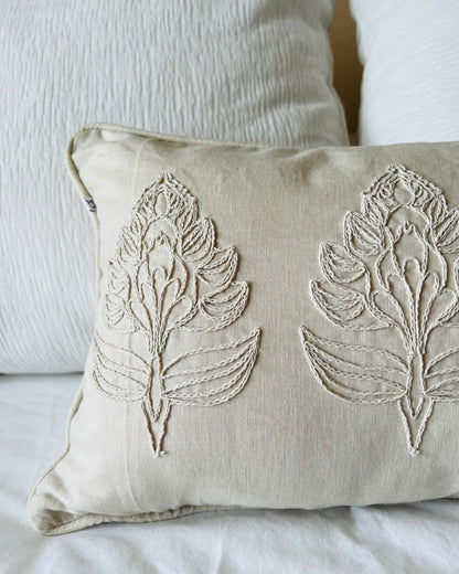 A close up of the Eloise Embroidered Pillow Cover showing its flower detail